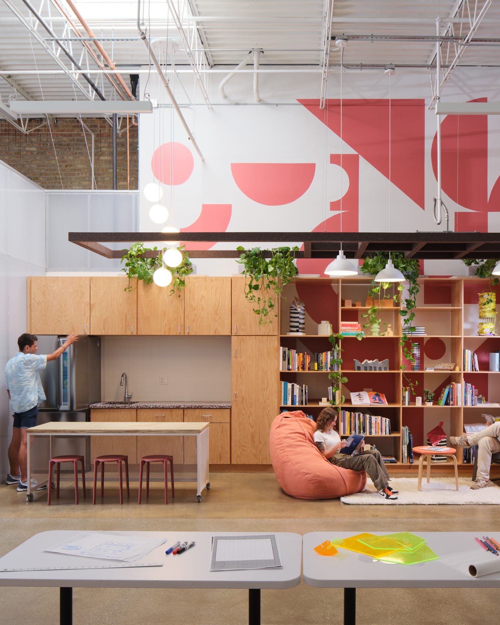 Plants, open space, and colorful pops define the inviting workshop spaces of Mobile Makers.
