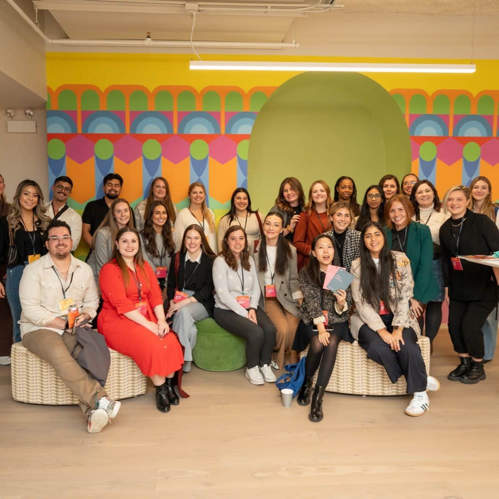 The 30/30 National Conference attendees in Chicago seated in the Momentum Textiles & Wallcovering showroom, showcasing the Yinka Ilori collaboration.